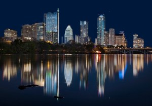Austin Texas skyline reflects in the water of the Colorado River in 2014.